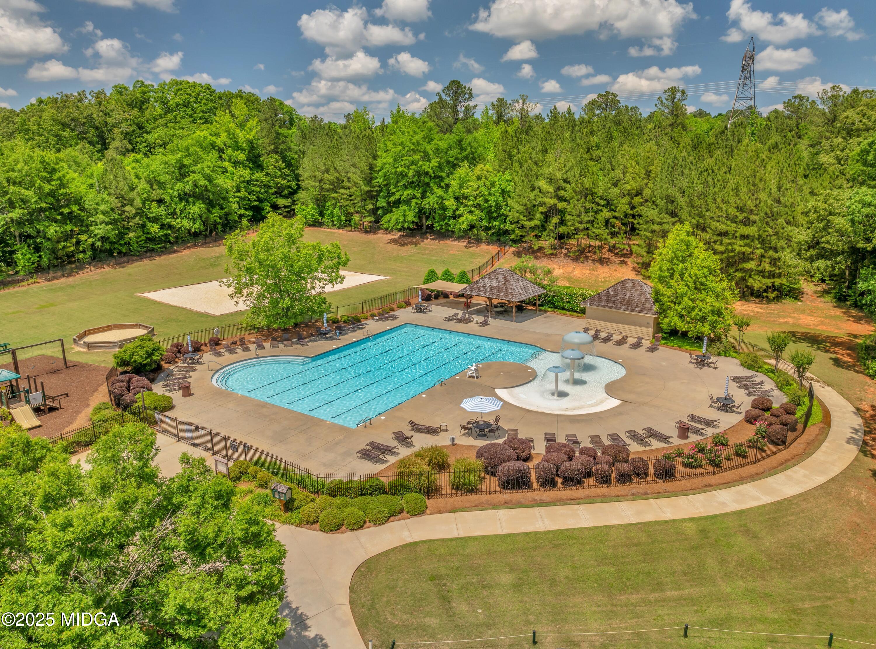 104 Piedmont Circle Forsyth, GA 31029 - Photo 41 of 42 a view of a swimming pool with a yard