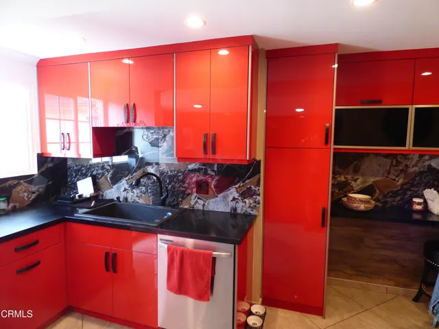 a room with furniture and a potted plant