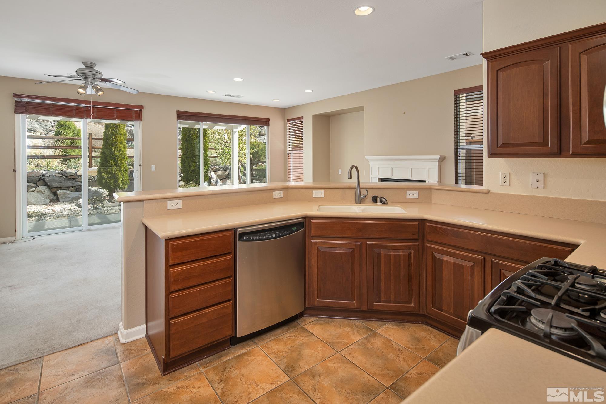 1180 Meridian Ranch Drive Reno, NV 89523 - Photo 11 of 28 a kitchen with a sink stove and cabinets