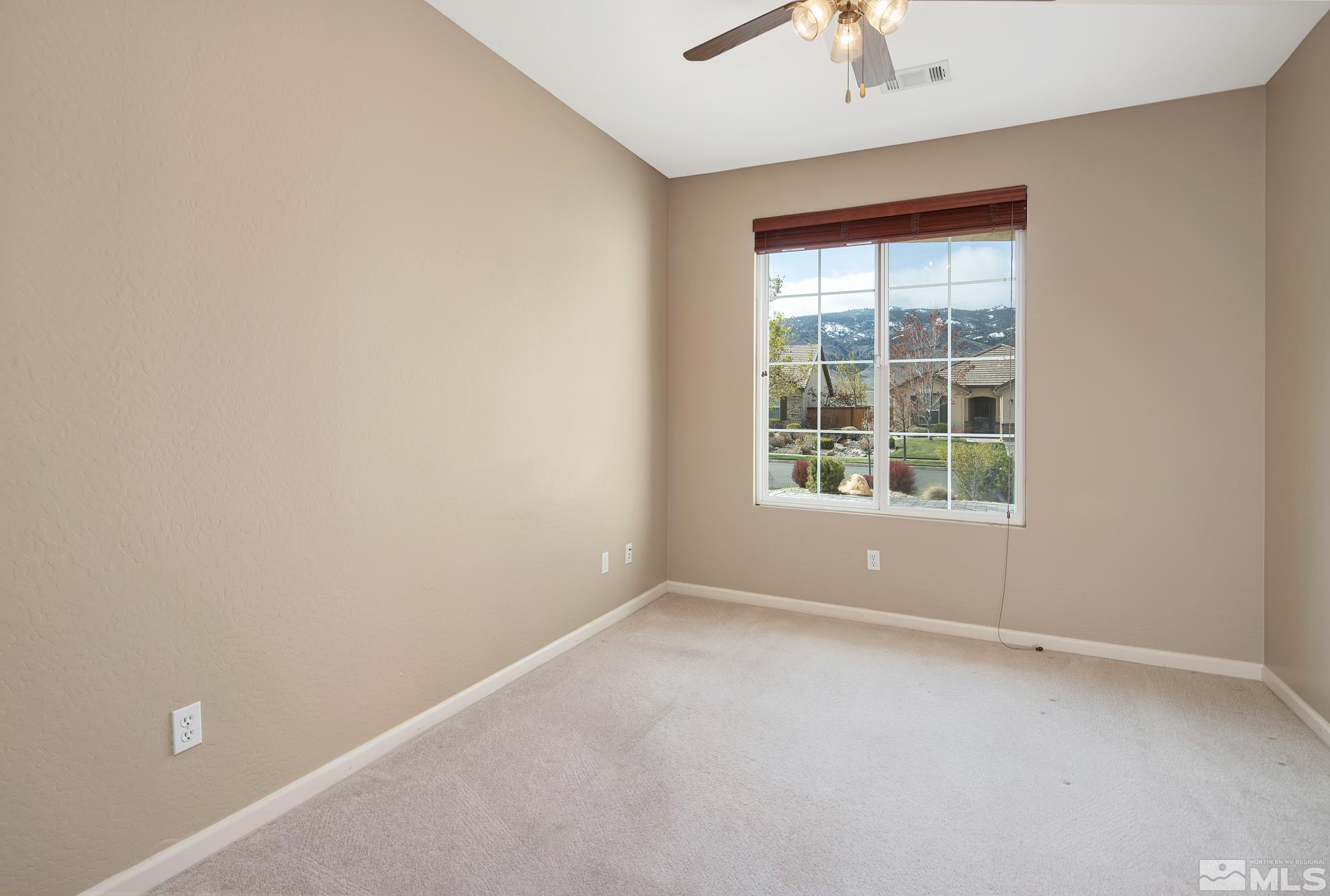 1180 Meridian Ranch Drive Reno, NV 89523 - Photo 14 of 28 an empty room with a window