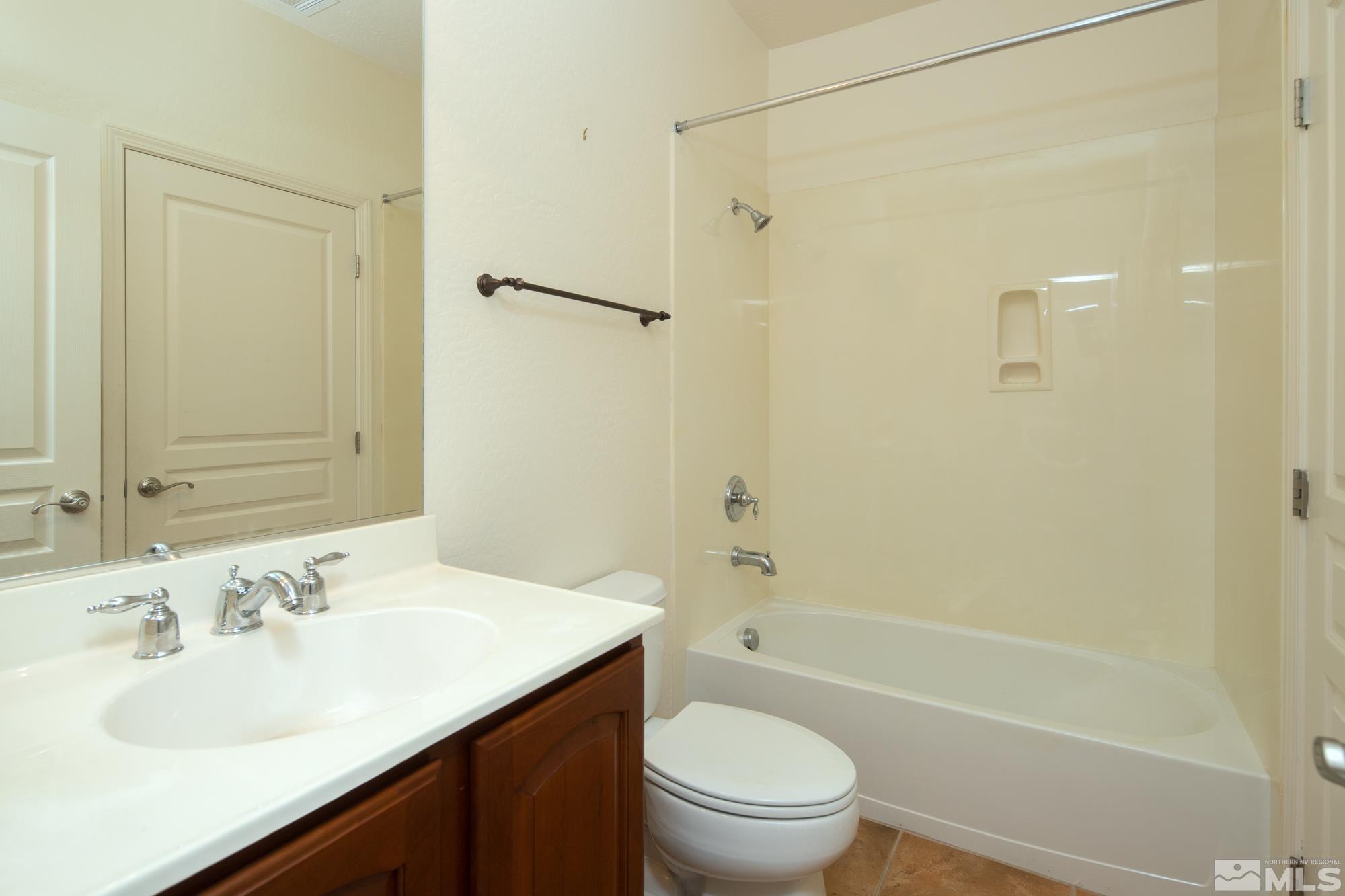 1180 Meridian Ranch Drive Reno, NV 89523 - Photo 20 of 28 a bathroom with a sink a toilet and shower