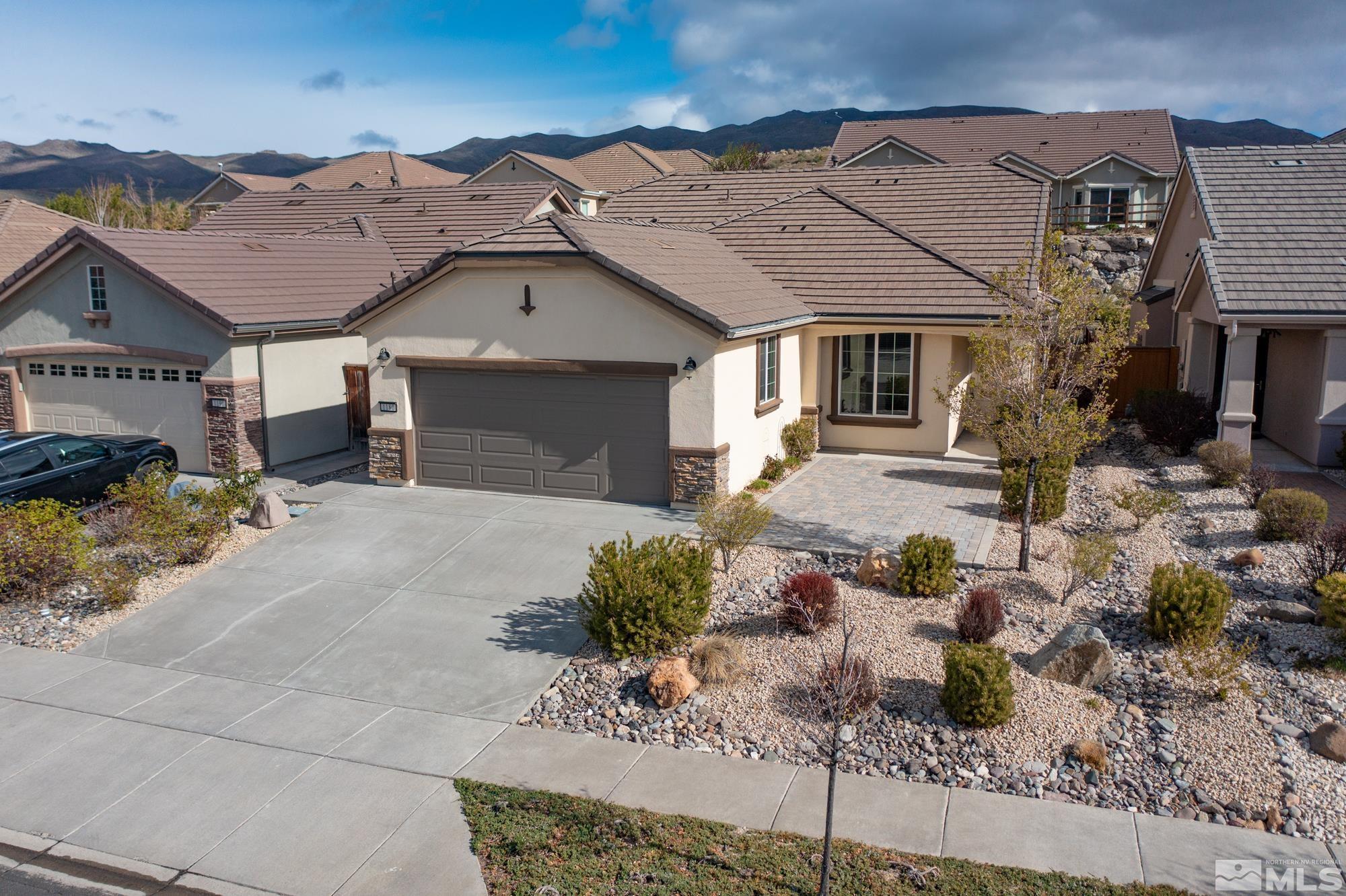 1180 Meridian Ranch Drive Reno, NV 89523 - Photo 2 of 28 a front view of a house with a yard