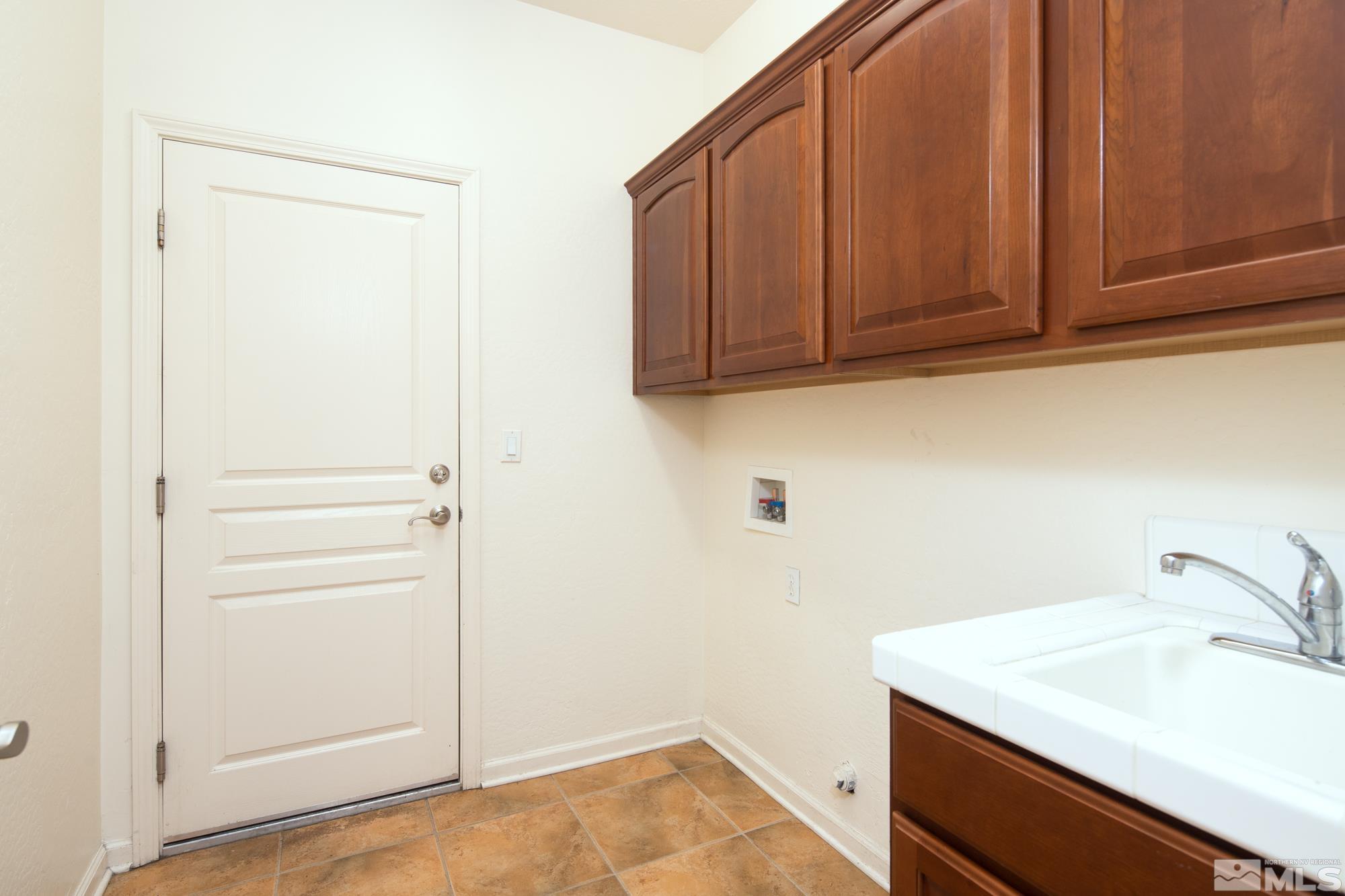 1180 Meridian Ranch Drive Reno, NV 89523 - Photo 24 of 28 a bathroom with a sink and cabinets