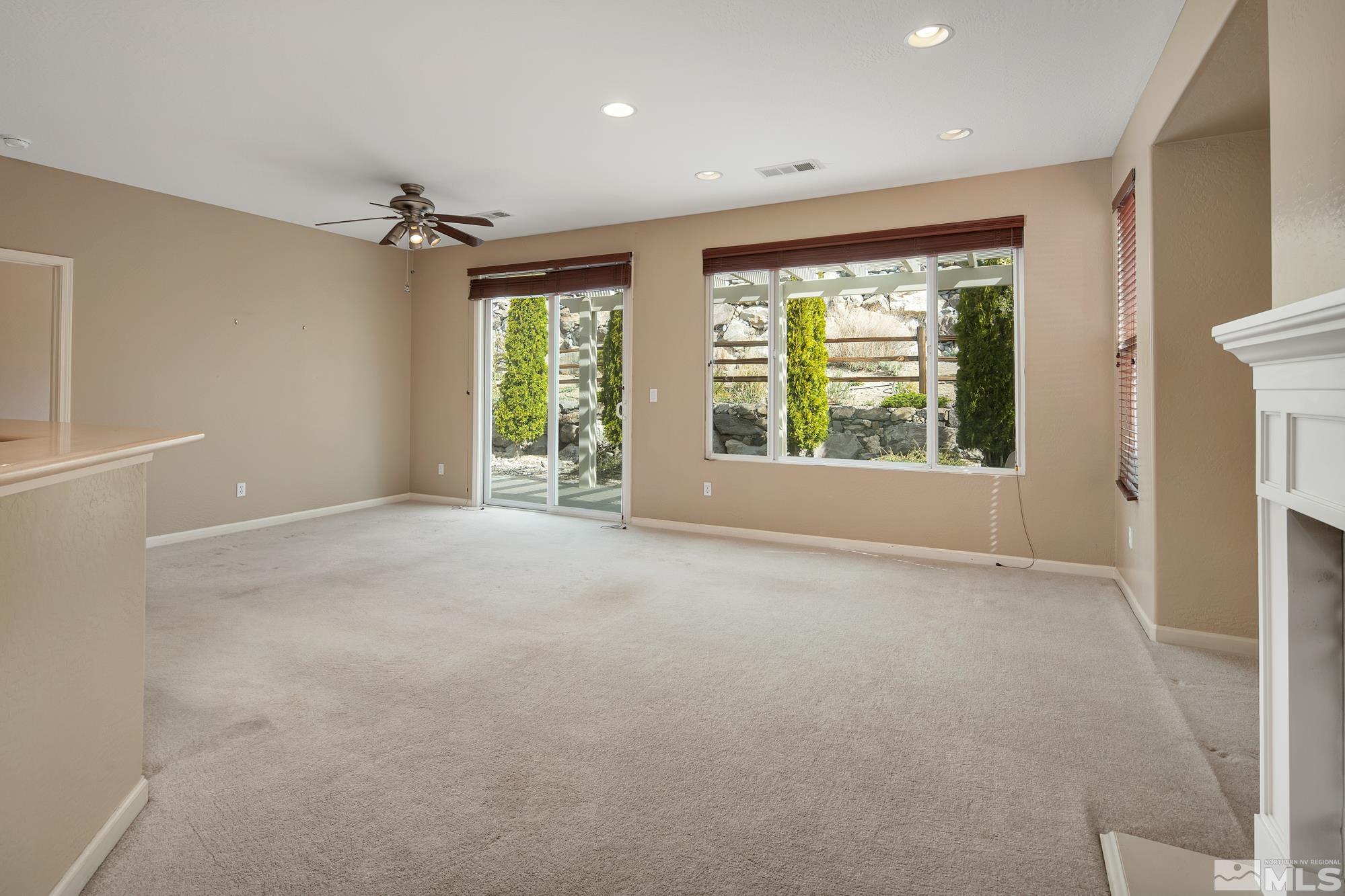 1180 Meridian Ranch Drive Reno, NV 89523 - Photo 4 of 28 a view of an empty room with a window