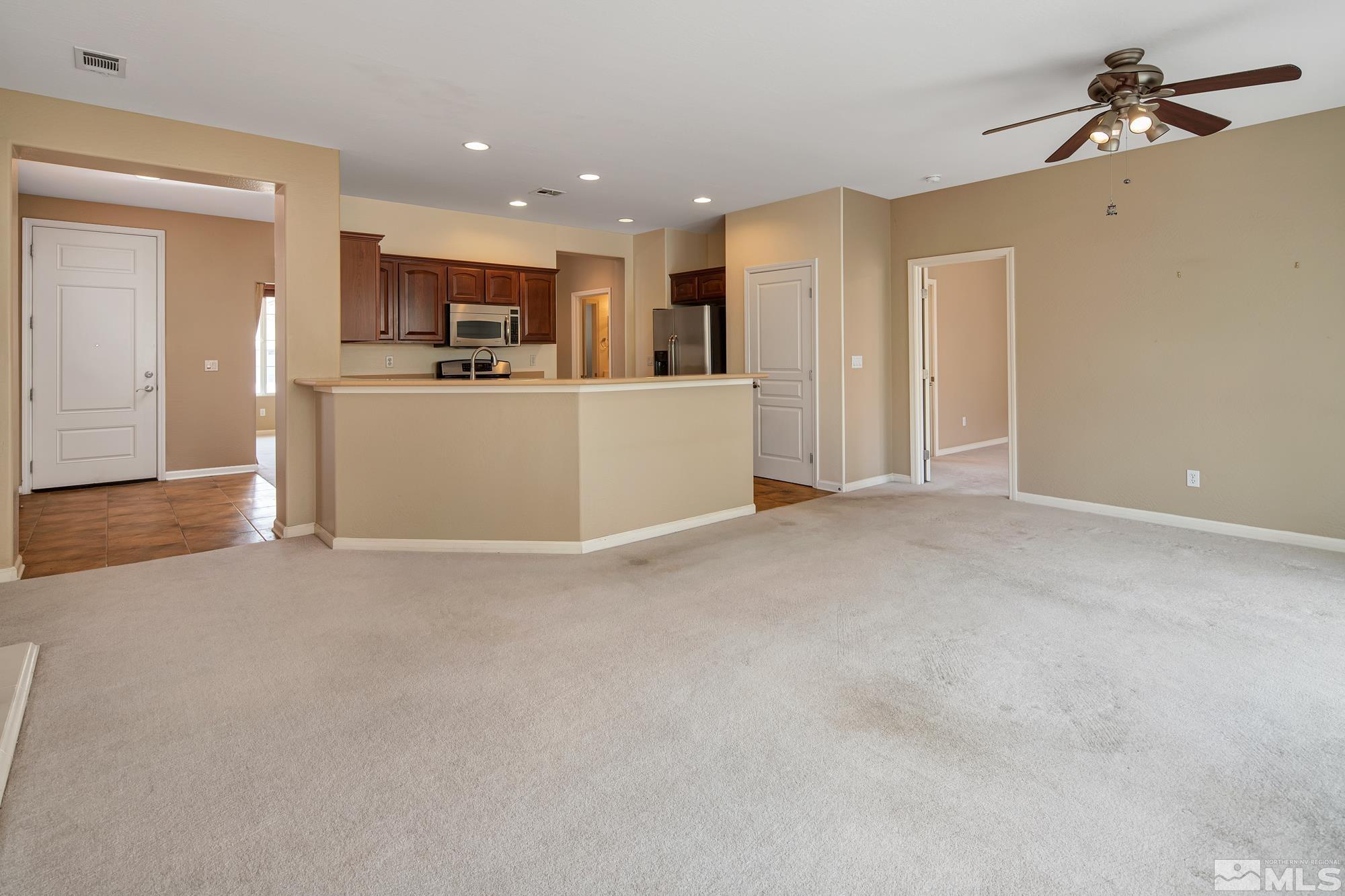 1180 Meridian Ranch Drive Reno, NV 89523 - Photo 5 of 28 a view of a kitchen with a sink and cabinets