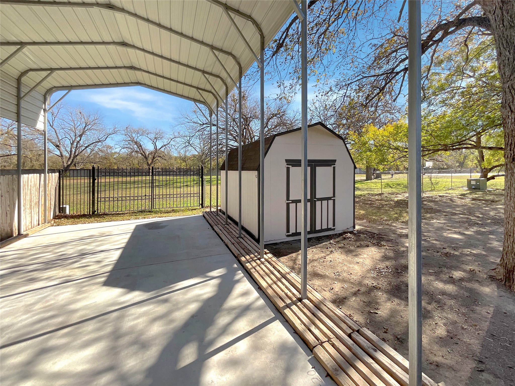 6805 Crystalbrook Drive Austin, TX 78724 - Photo 28 of 31 a view of backyard with large tree and wooden fence