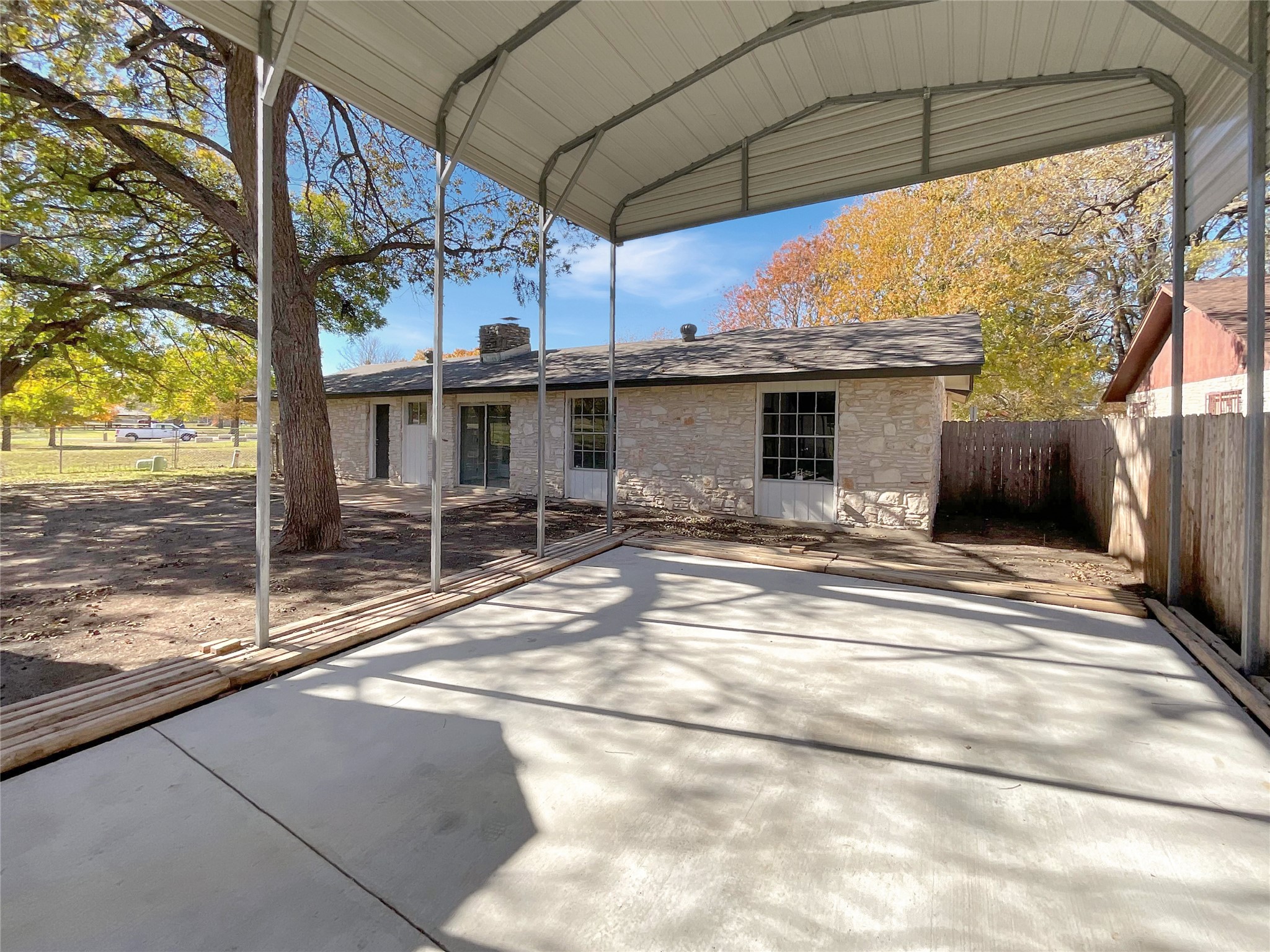 6805 Crystalbrook Drive Austin, TX 78724 - Photo 30 of 31 a view of a terrace with a table and chairs under an umbrella