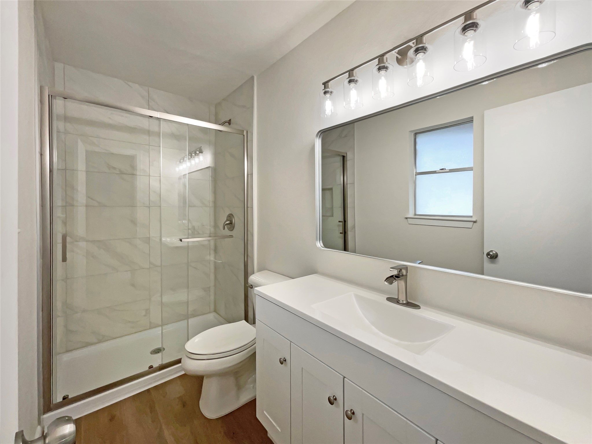 6805 Crystalbrook Drive Austin, TX 78724 - Photo 6 of 31 a bathroom with a sink a toilet and shower