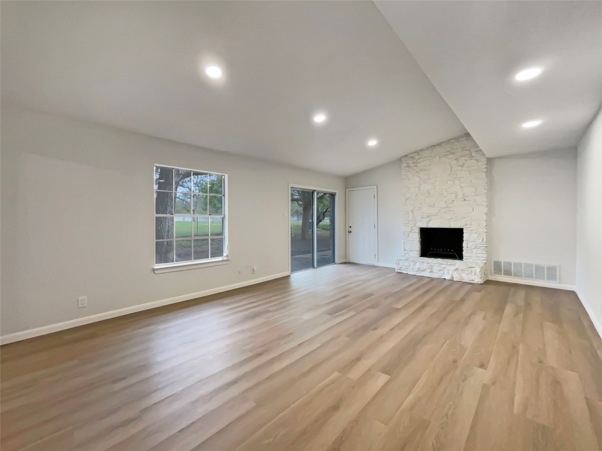 6805 Crystalbrook Drive Austin, TX 78724 - Photo 7 of 31 a view of empty room with wooden floor and windows