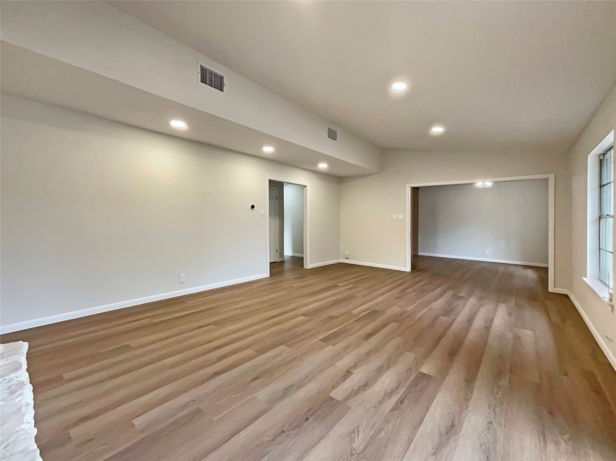 6805 Crystalbrook Drive Austin, TX 78724 - Photo 9 of 31 a view of an empty room with wooden floor