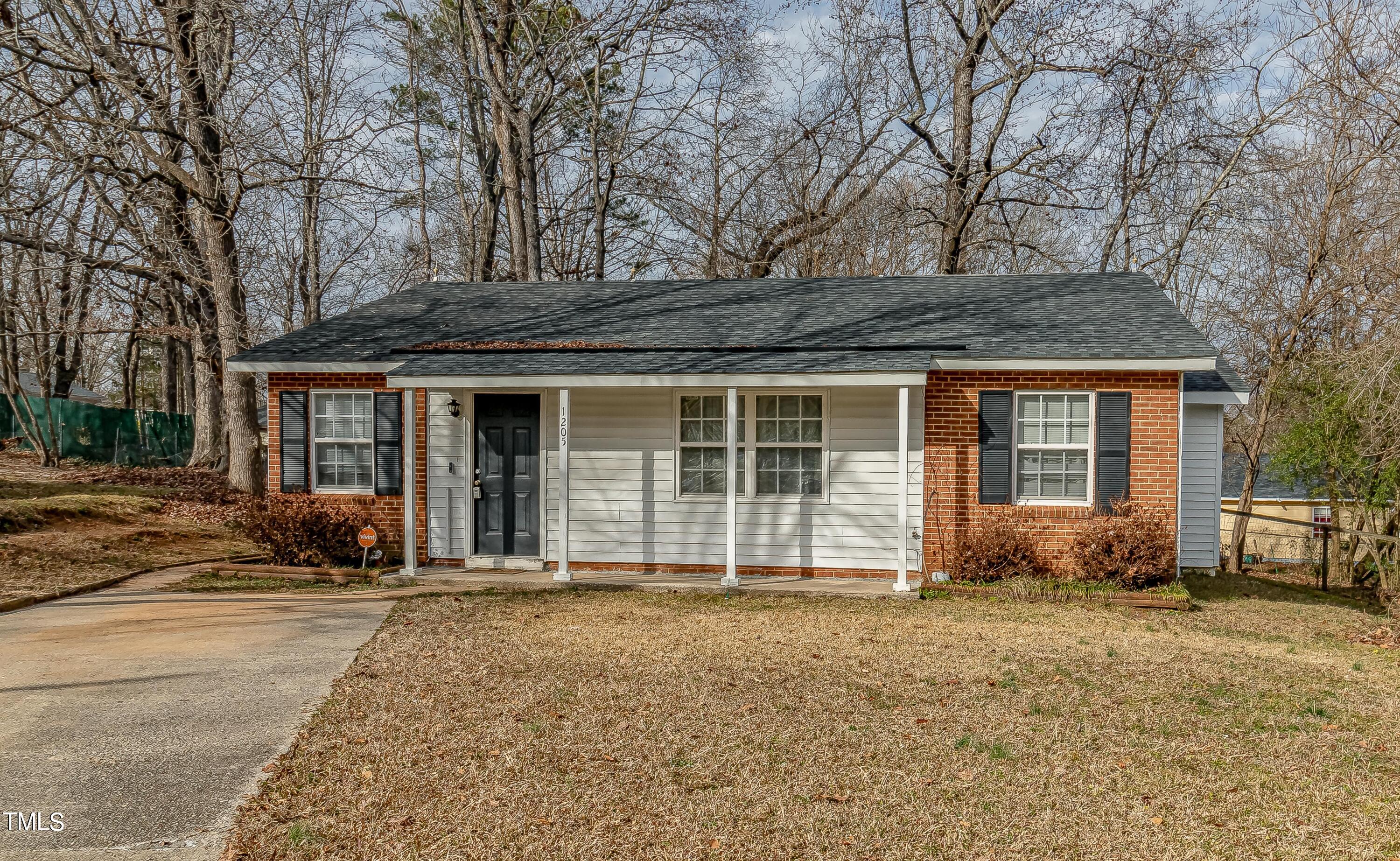 1205 Armstrong Circle Raleigh, NC 27610 - Photo 1 of 31 front view of a house with a yard