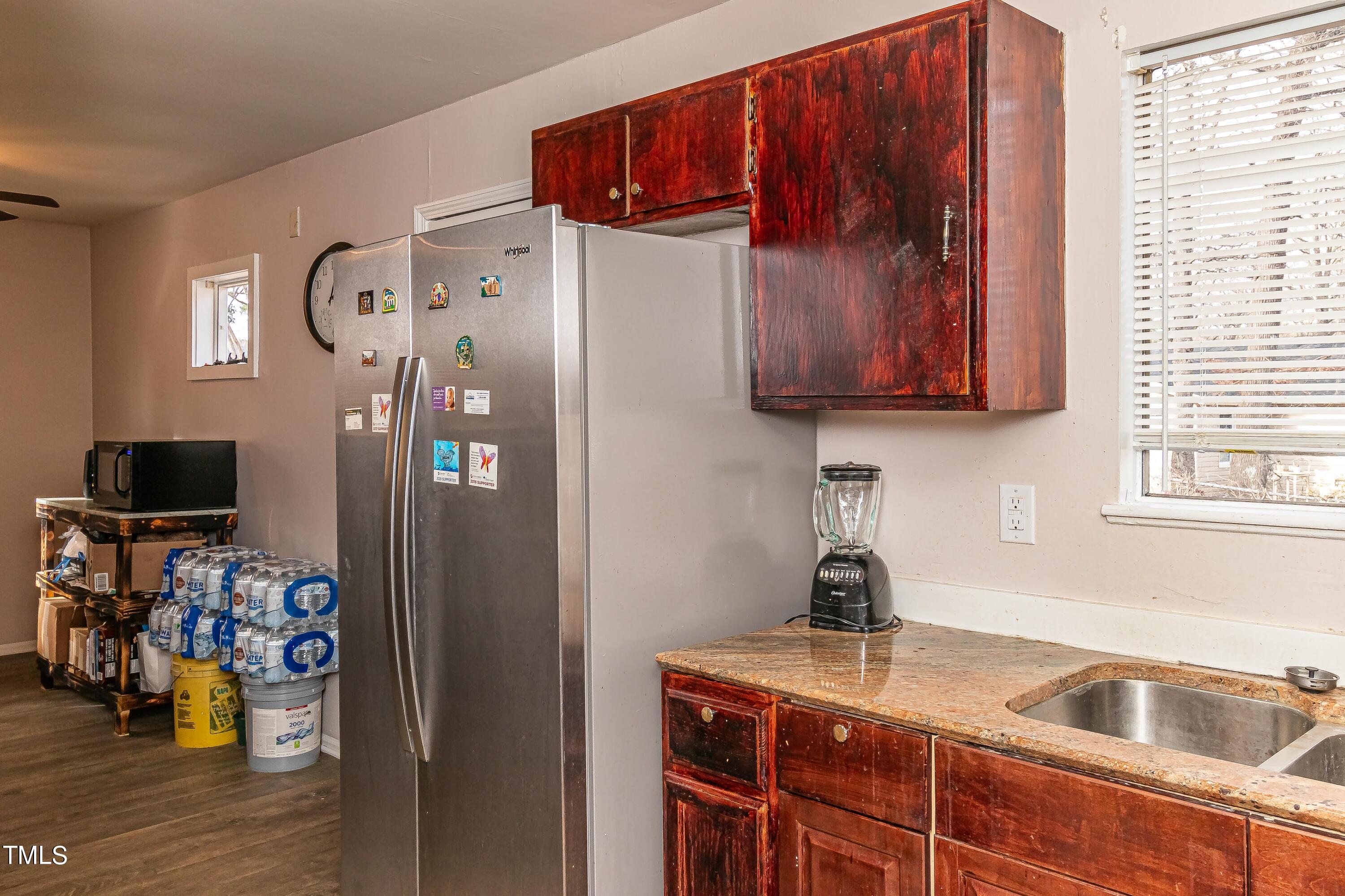 1205 Armstrong Circle Raleigh, NC 27610 - Photo 11 of 31 a kitchen with stainless steel appliances granite countertop a refrigerator and a sink