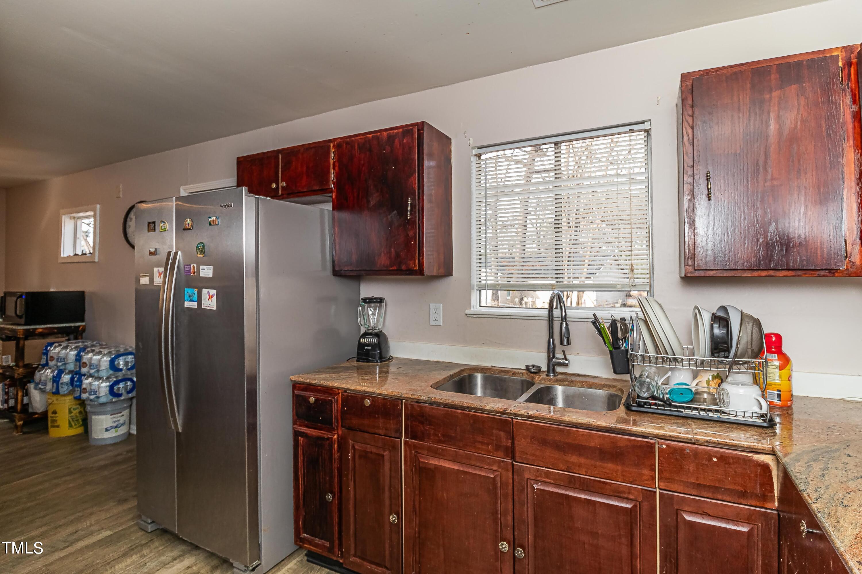 1205 Armstrong Circle Raleigh, NC 27610 - Photo 12 of 31 a kitchen with stainless steel appliances granite countertop a refrigerator and a sink