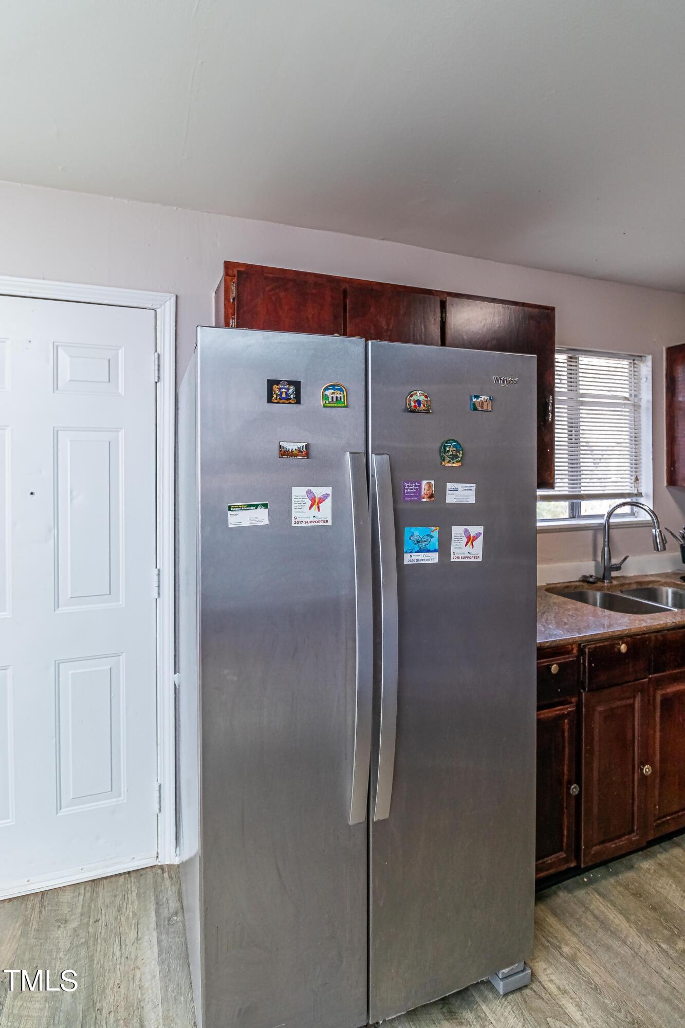 1205 Armstrong Circle Raleigh, NC 27610 - Photo 14 of 31 a kitchen with stainless steel appliances granite countertop a refrigerator and a sink