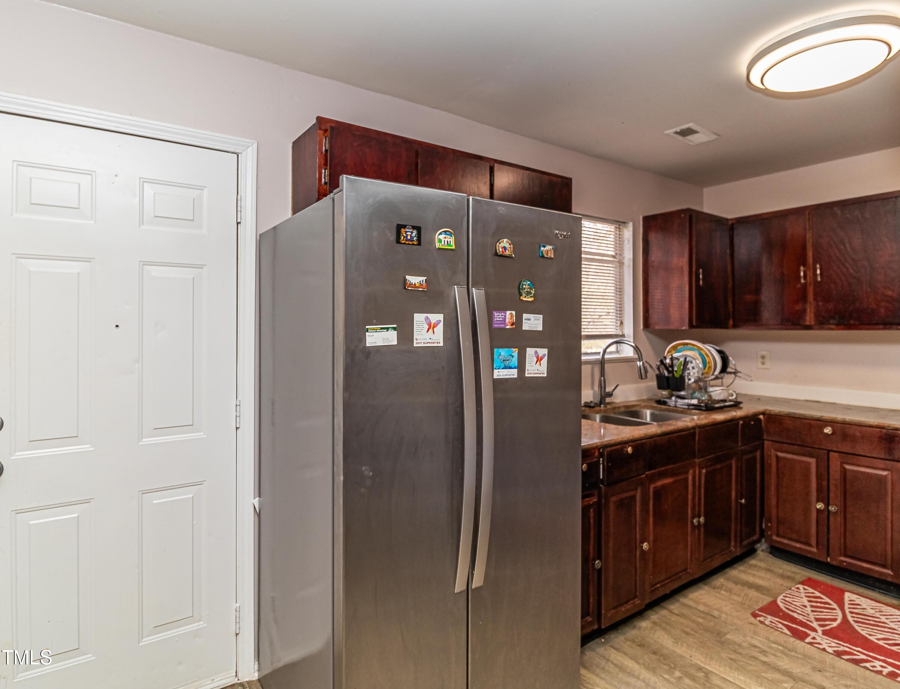 1205 Armstrong Circle Raleigh, NC 27610 - Photo 15 of 31 a kitchen with stainless steel appliances granite countertop a refrigerator and a sink