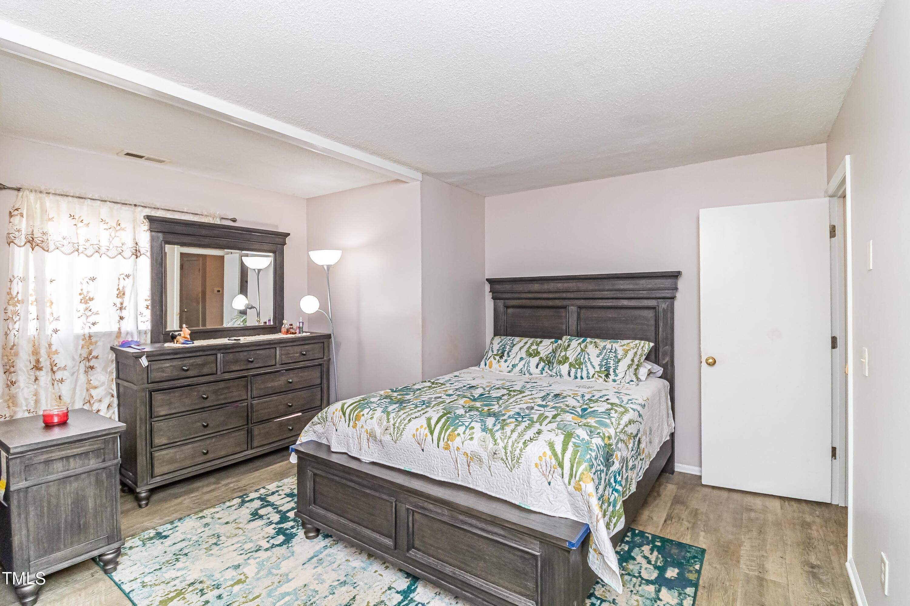 1205 Armstrong Circle Raleigh, NC 27610 - Photo 18 of 31 a bed room with a bed and a window