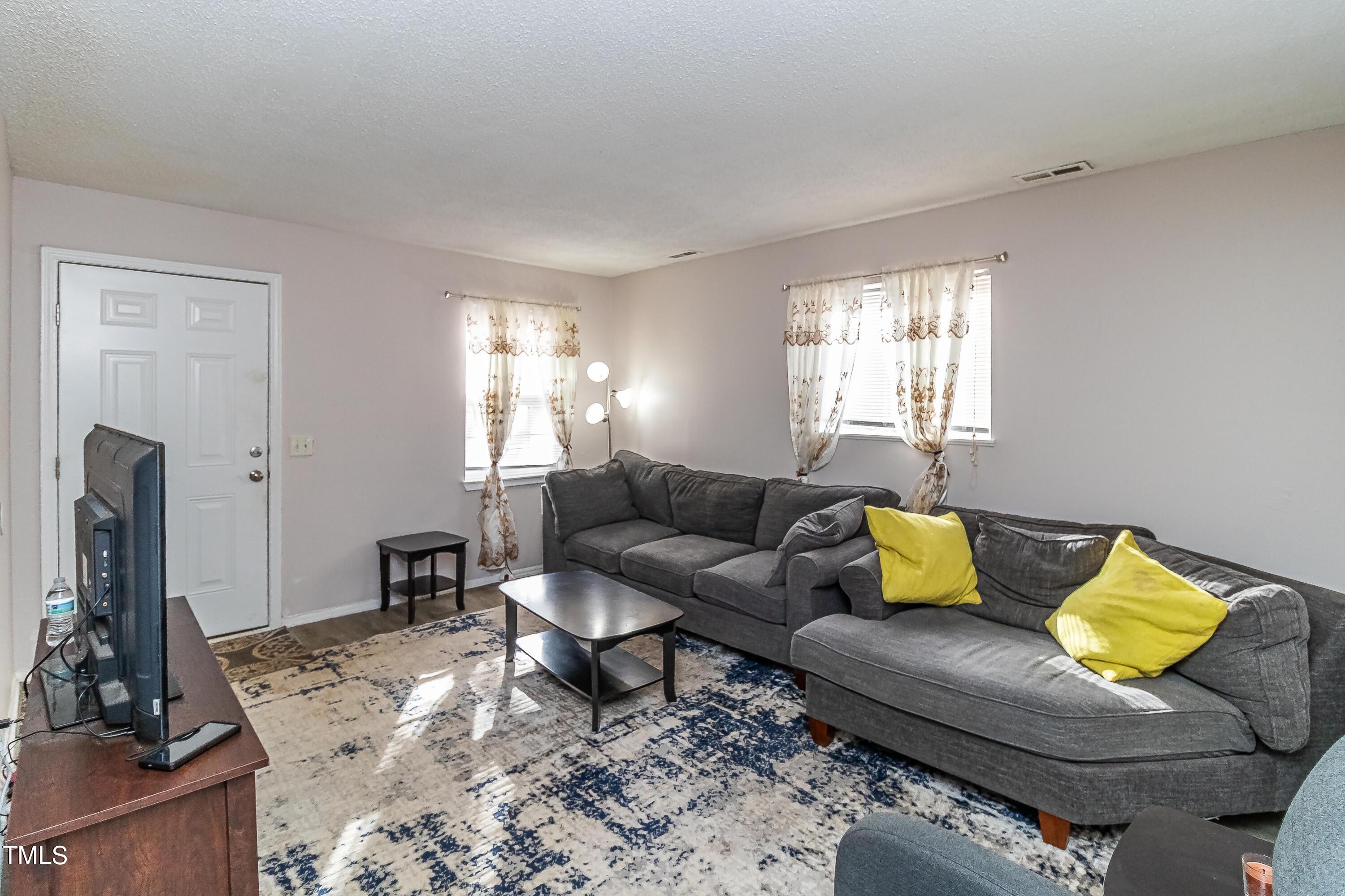 1205 Armstrong Circle Raleigh, NC 27610 - Photo 2 of 31 a living room with furniture and a couch