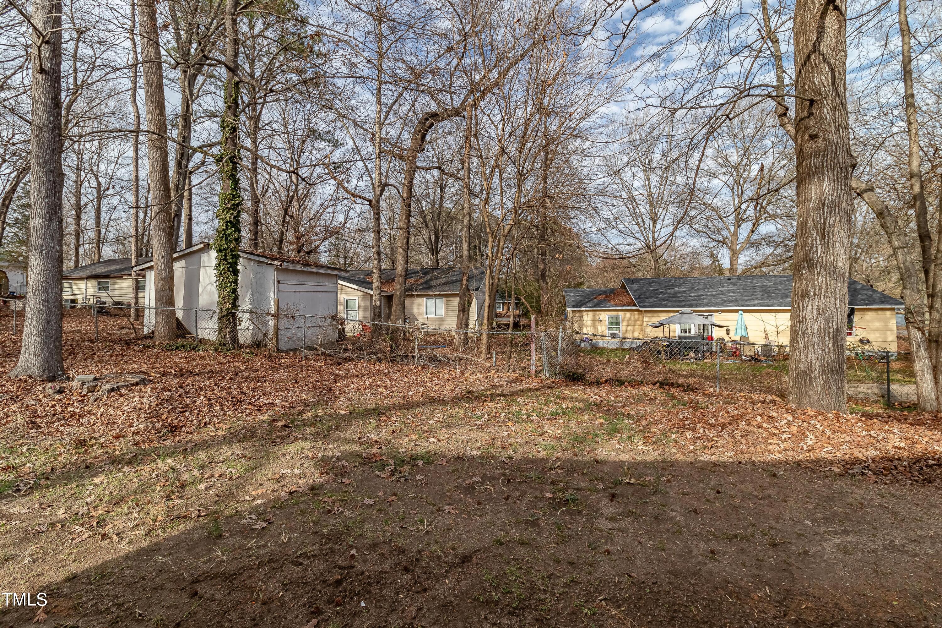 1205 Armstrong Circle Raleigh, NC 27610 - Photo 21 of 31 a view of a yard covered with snow in front of house