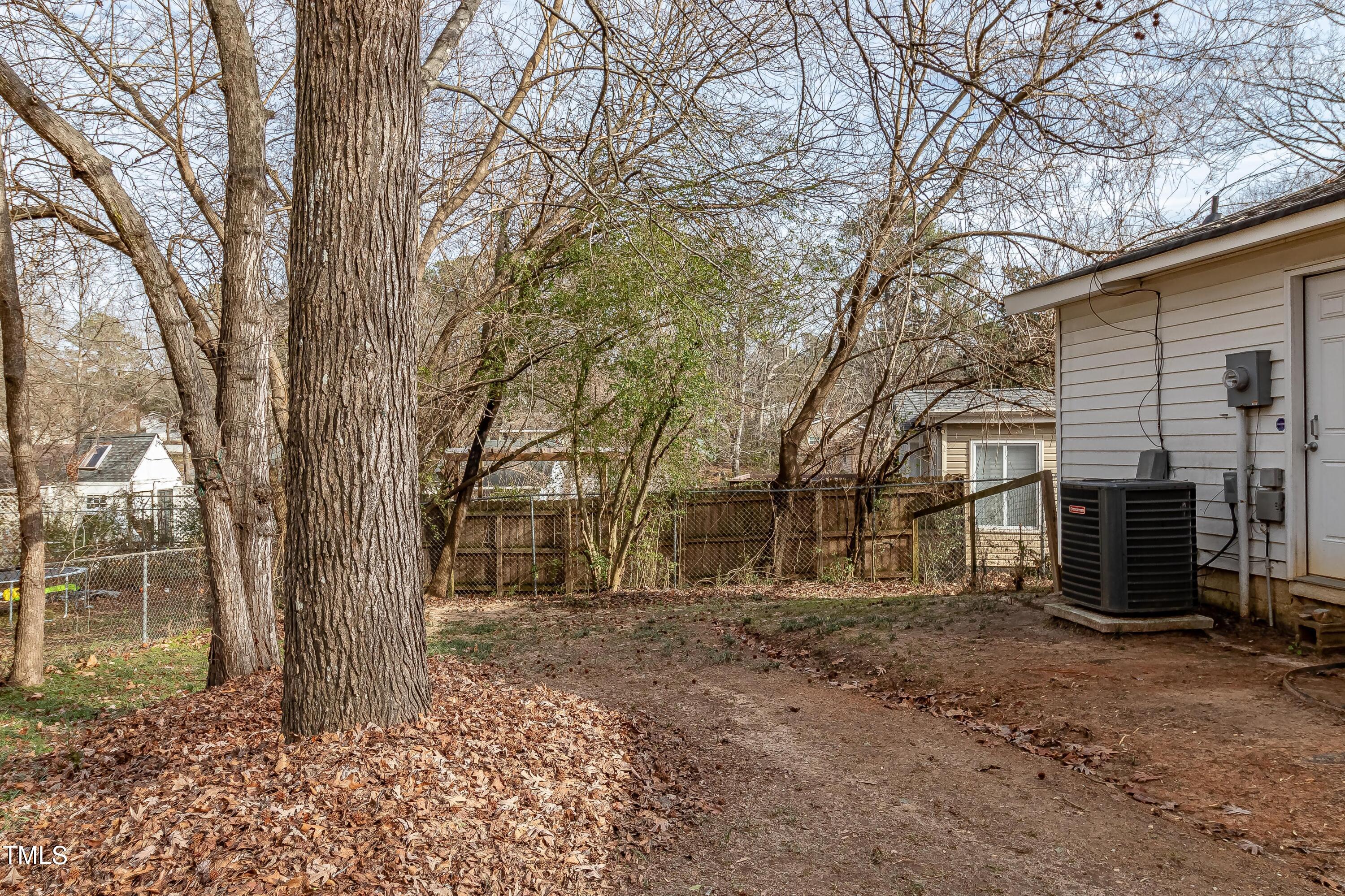 1205 Armstrong Circle Raleigh, NC 27610 - Photo 23 of 31 a view of a backyard with large trees