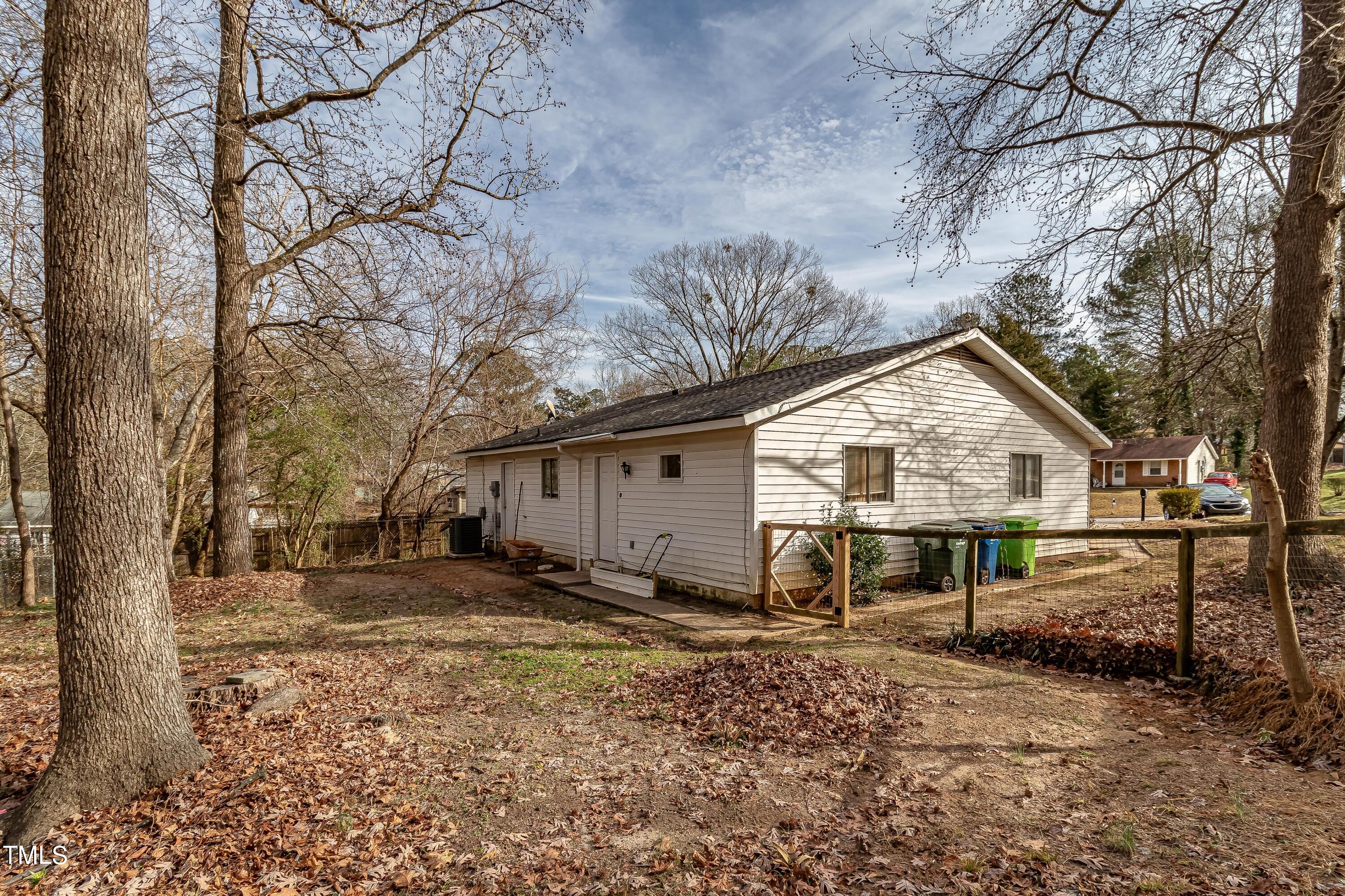 1205 Armstrong Circle Raleigh, NC 27610 - Photo 28 of 31 a view of a house with backyard and trees