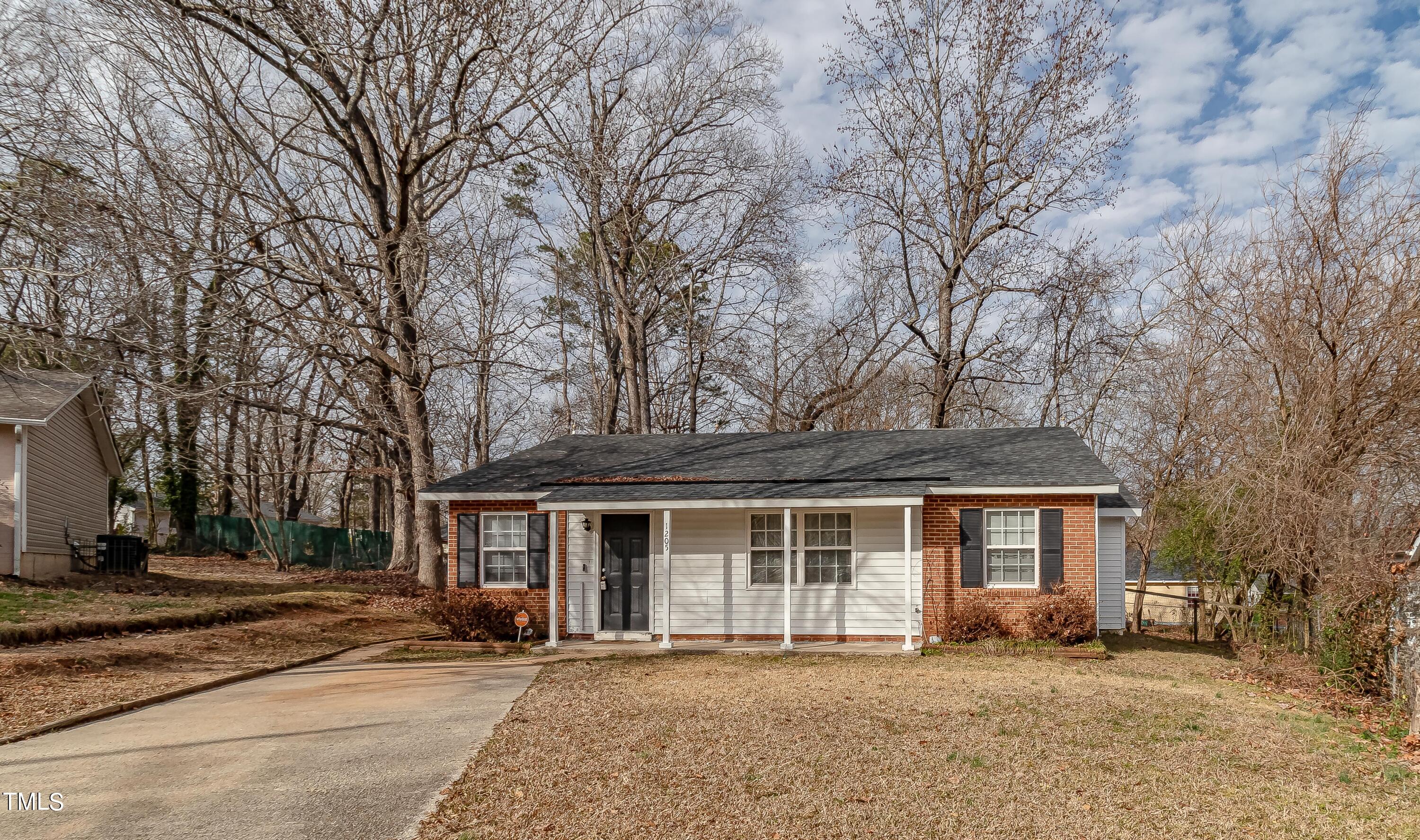 1205 Armstrong Circle Raleigh, NC 27610 - Photo 30 of 31 a front view of a house with a garden