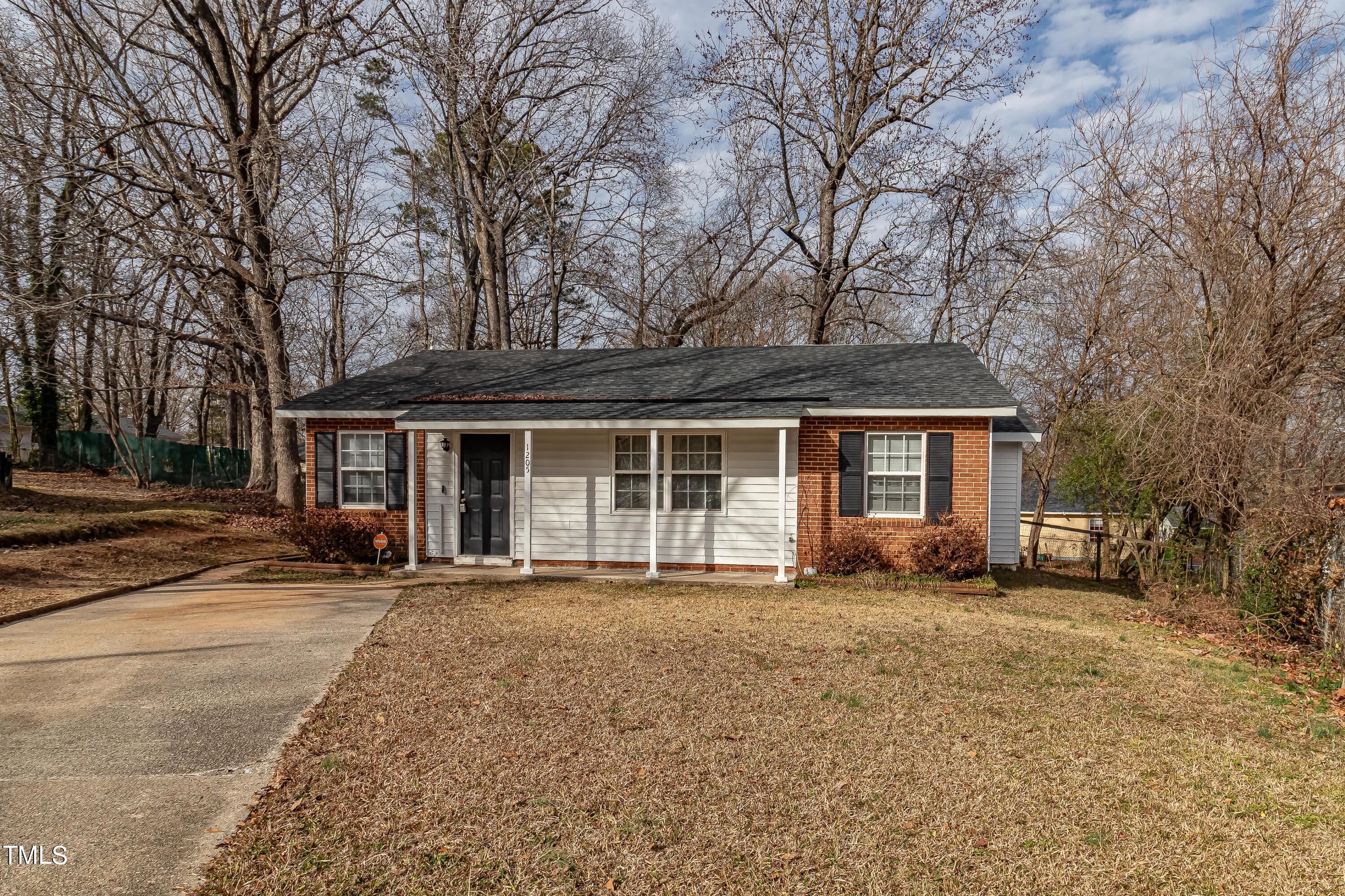 1205 Armstrong Circle Raleigh, NC 27610 - Photo 31 of 31 a front view of a house with a garden