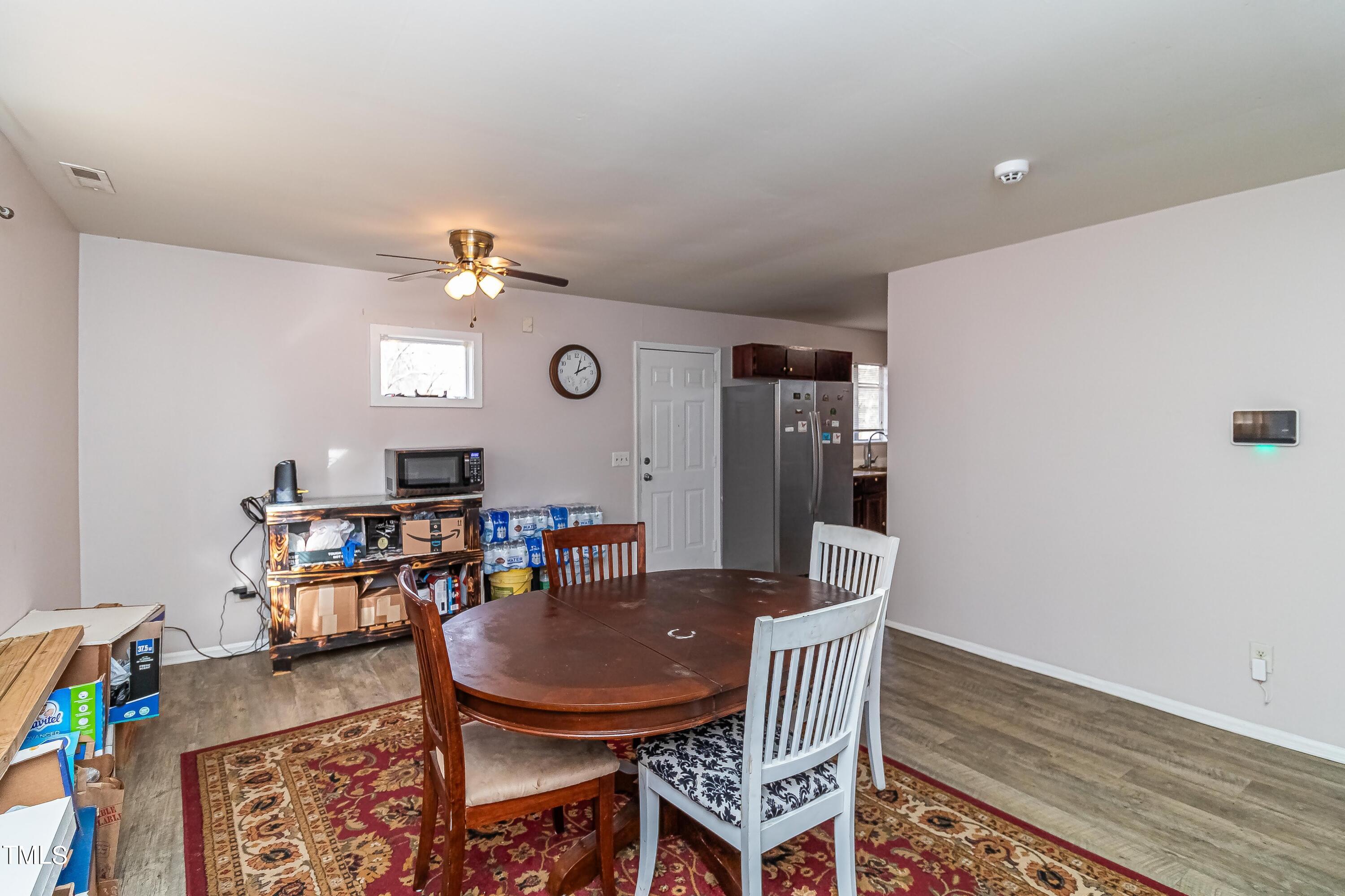 1205 Armstrong Circle Raleigh, NC 27610 - Photo 5 of 31 a view of a dining room with furniture and wooden floor