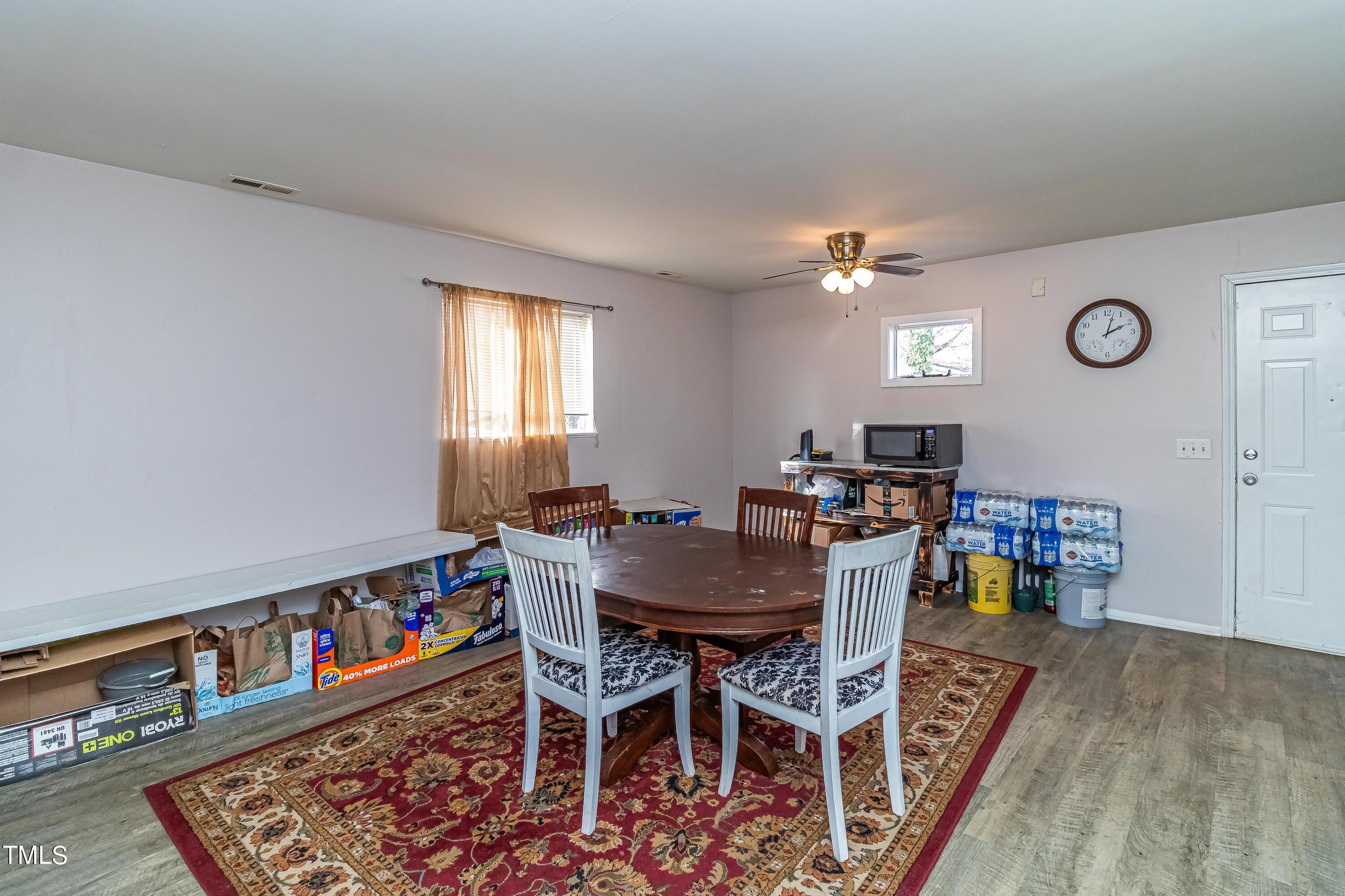 1205 Armstrong Circle Raleigh, NC 27610 - Photo 6 of 31 a view of a dining room with furniture and a window