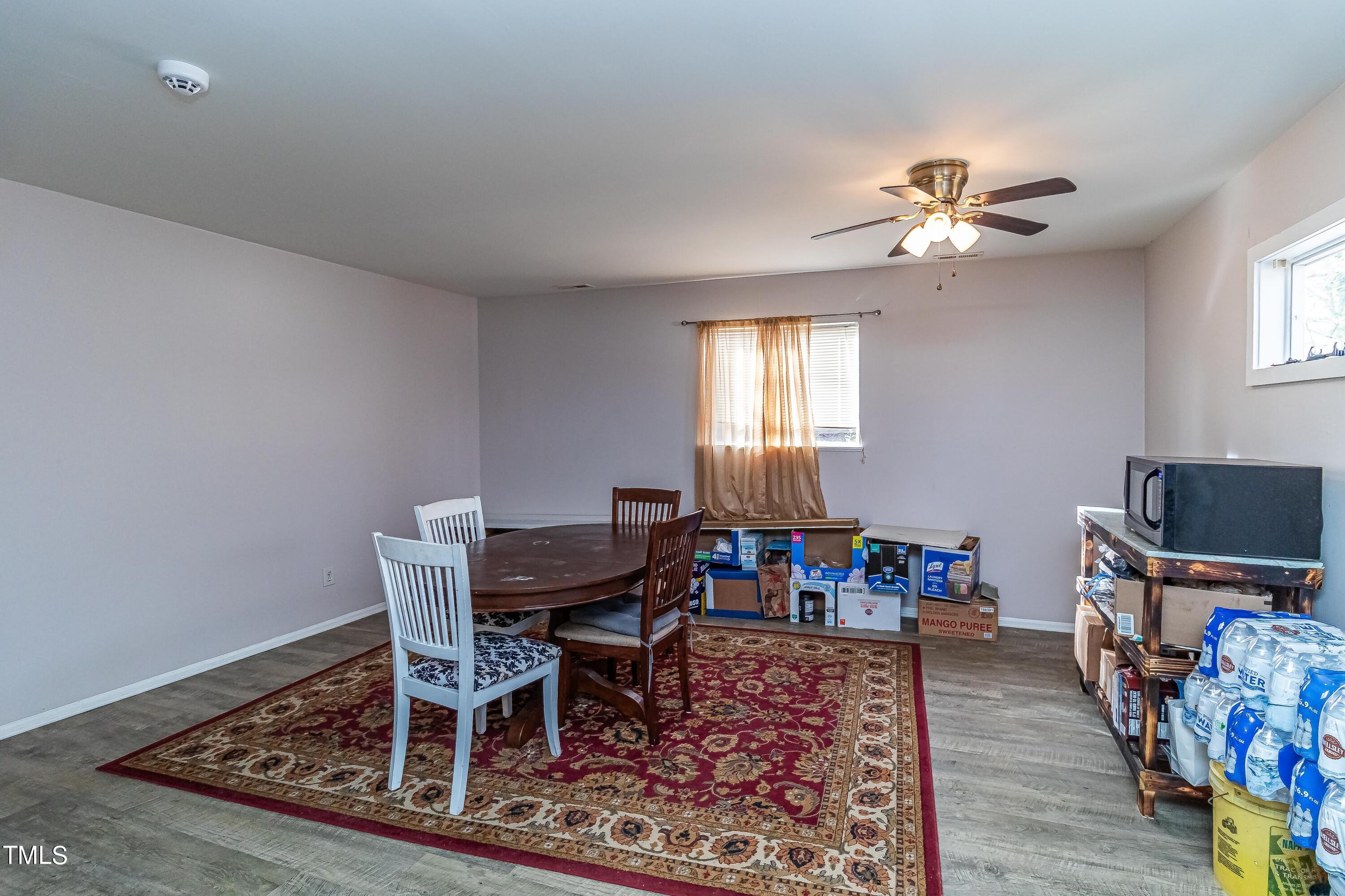 1205 Armstrong Circle Raleigh, NC 27610 - Photo 7 of 31 a view of a dining room with furniture and wooden floor