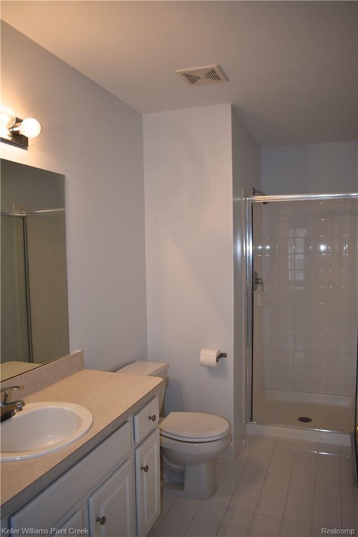 1885 Flagstone Circle Rochester, MI 48307 - Photo 27 of 32 THE LARGE MASTER BATHROOM (6 X 11) CONTAINS AN "OVERSIZED" SHOWER & A CERAMIC TILE FLOOR.