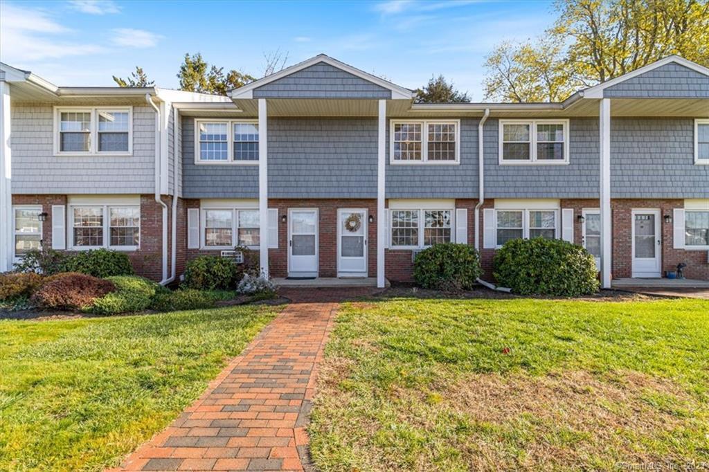 25 Riverside Drive, Unit A3 Clinton, CT 06413 - Photo 1 of 1 a front view of a house with garden