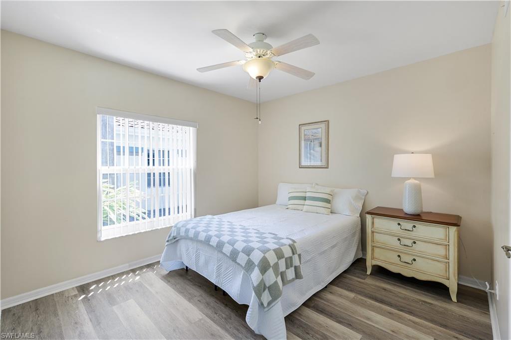 10900 Santa Margherita Road, Unit 102 Estero, FL 34135 - Photo 15 of 34 a bedroom with a bed and window