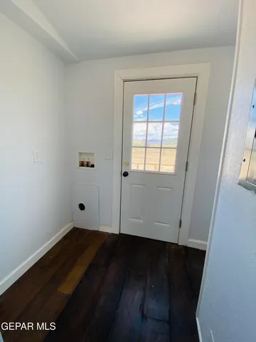 a view of a kitchen cabinets and wooden floor