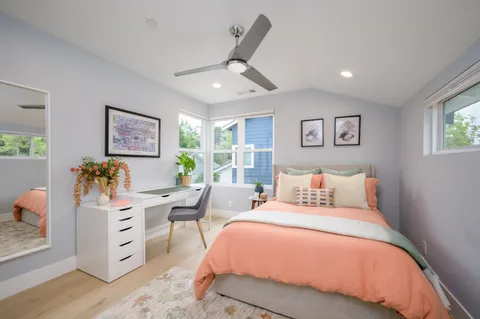 a bed room with bed and a window