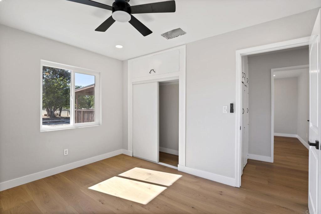 611 9th Street Ramona, CA 92065 - Photo 16 of 39 a view of an empty room with wooden floor and a window