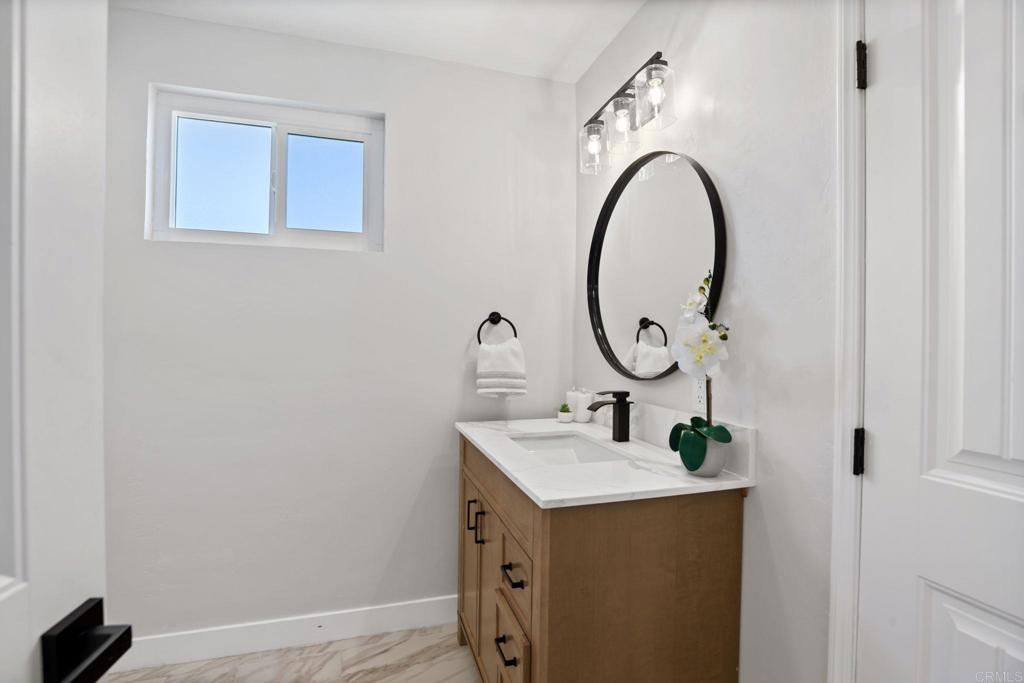 611 9th Street Ramona, CA 92065 - Photo 22 of 39 a bathroom with a sink and a mirror