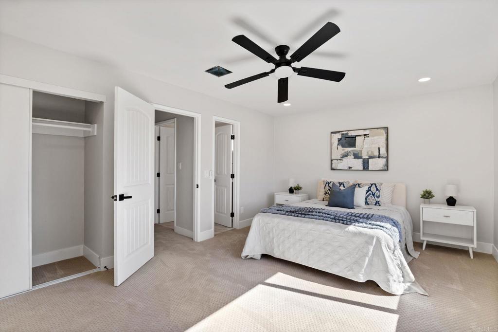 611 9th Street Ramona, CA 92065 - Photo 24 of 39 a bedroom with a bed and a ceiling fan
