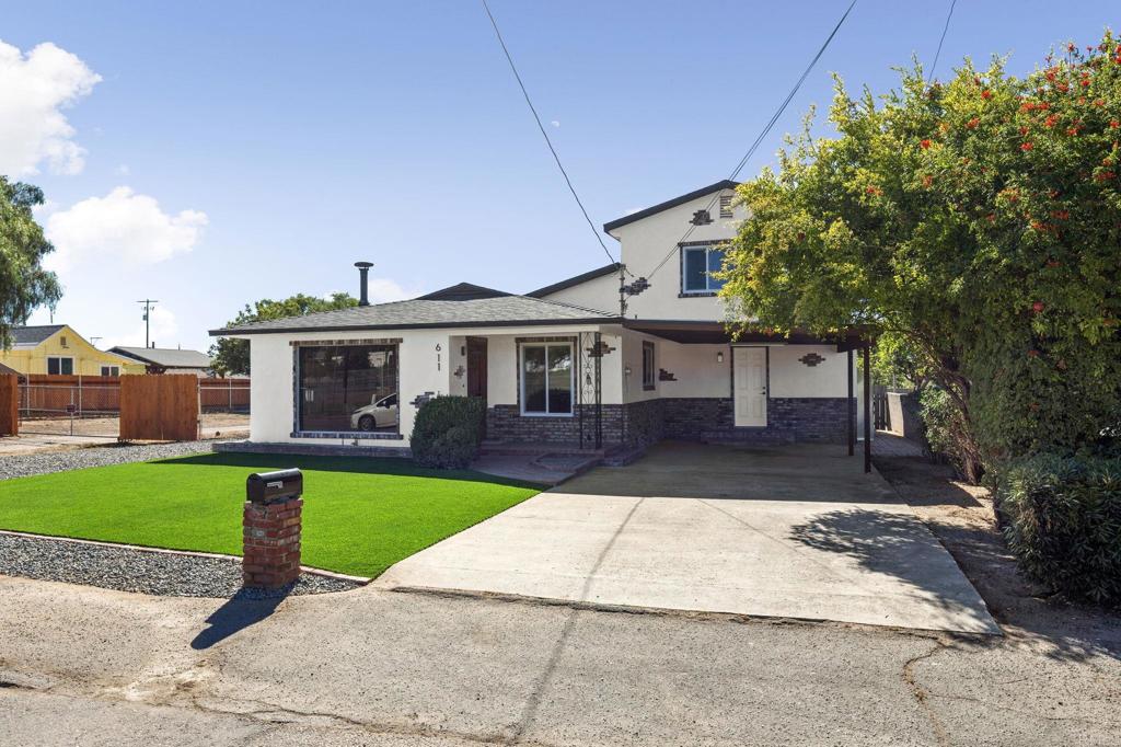 611 9th Street Ramona, CA 92065 - Photo 3 of 39 a front view of a house with yard patio and green space