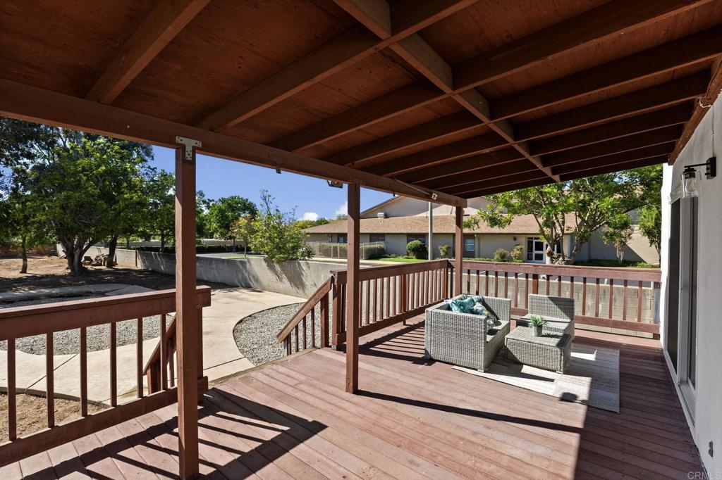 611 9th Street Ramona, CA 92065 - Photo 32 of 39 a view of a balcony with chairs and wooden floor