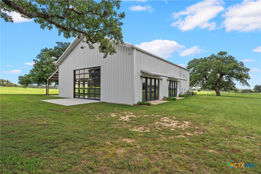 1006 County Road 280 Cameron, TX 76520 - Photo 16 of 48 a view of a house with a yard