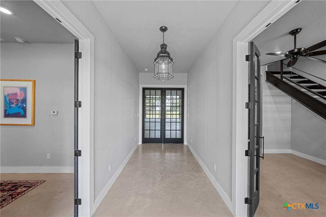 1006 County Road 280 Cameron, TX 76520 - Photo 30 of 48 a view of a hallway with a dining room