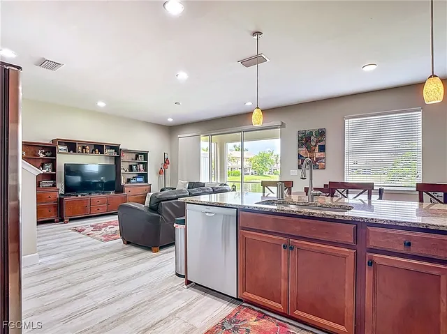 a kitchen with lots of counter top space and stainless steel appliances