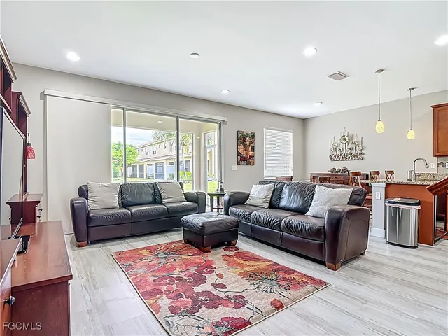 a living room with furniture and a rug