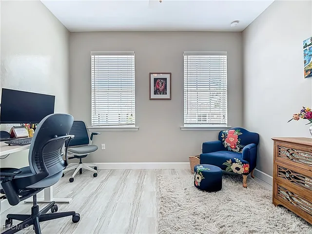 a workspace with furniture and a window