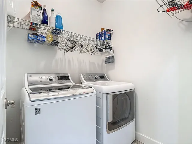 a view of a garage with rack and bicycle