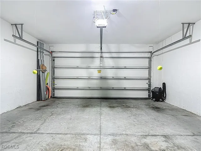 a front view of a house with a big yard and potted plants