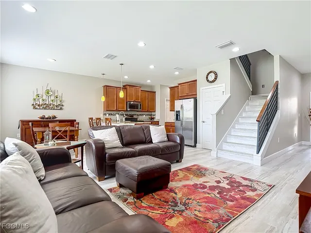 a living room with furniture and a rug