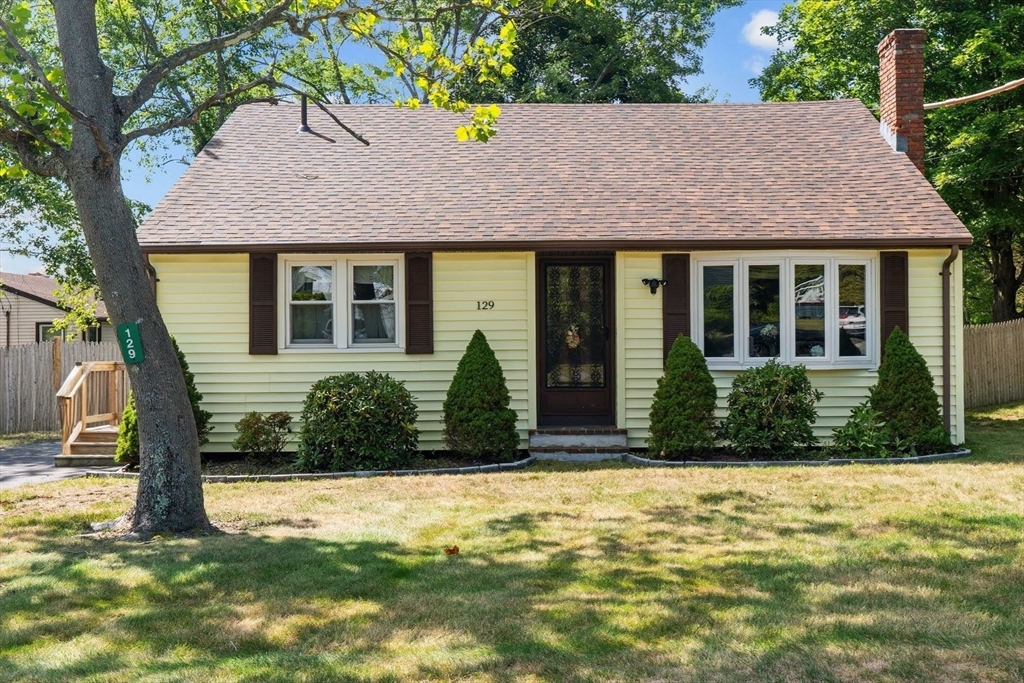 129 Anawan Street Brockton, MA 02302 - Photo 1 of 10 front view of a house with a yard