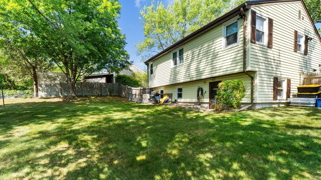 129 Anawan Street Brockton, MA 02302 - Photo 5 of 10 a view of a house with a backyard