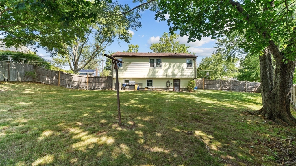 129 Anawan Street Brockton, MA 02302 - Photo 6 of 10 a view of a house with a yard